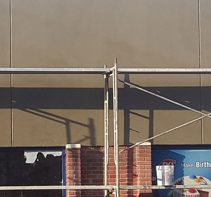 Exterior framing and scaffolding on a commercial storefront
